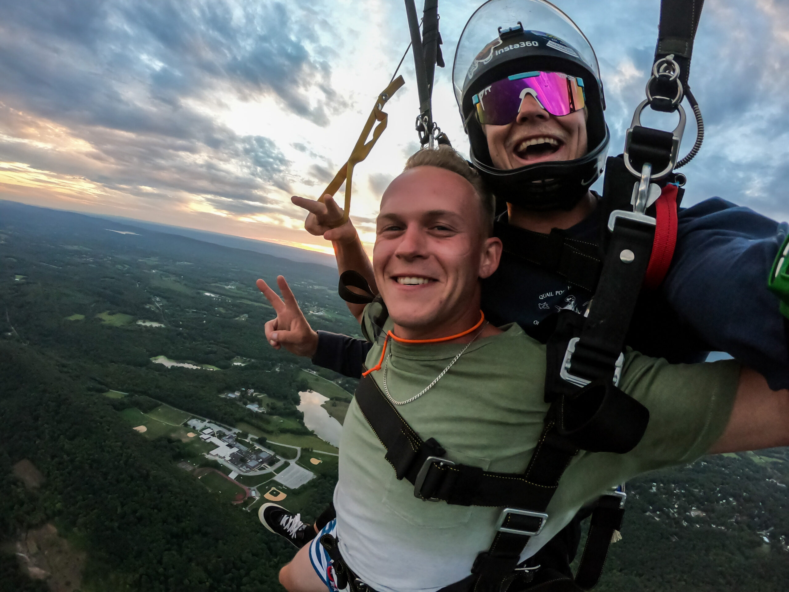 tandem skydiver flying parachute Tandem Skydiver flying parachute over New York area